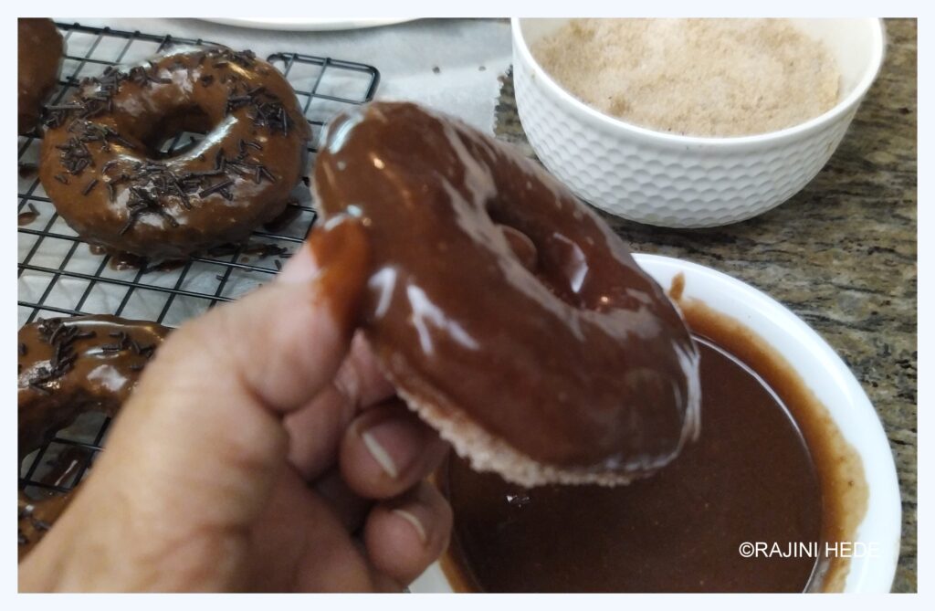 Dunk one side of the doughnut in Chocolate glaze